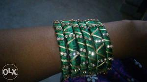 Six Green And Silver Bracelets