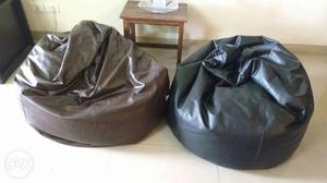 Two Brown And Black Leather Bin Bags
