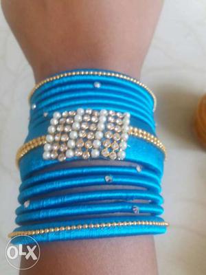White, Blue, And Gold Beaded Silk Bangles