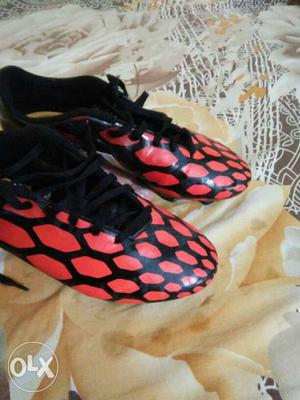 Pair Of Black-and-red Cleat Soccer Shoes