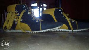 Pair Of Black-and-yellow High-top Sneakers