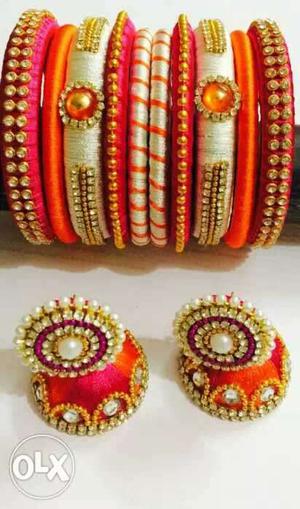 Pair Of White Pearl, Diamond And Orange Jhumka Earrings And