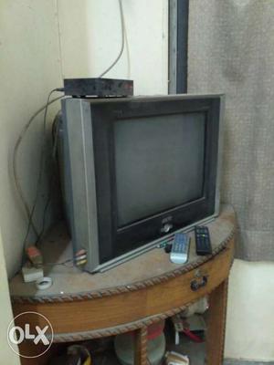 Black and silver 21 inches AKAI tv with dish tv