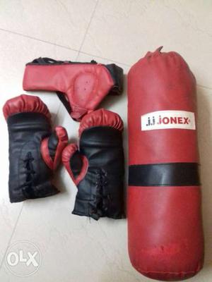 Red And Black Boxing Gloves, Mask And J.J. Jonex Training