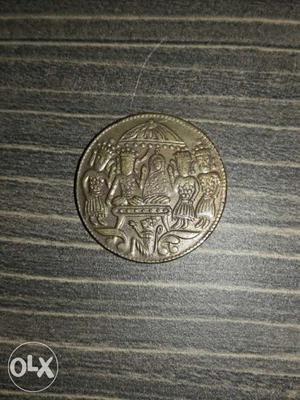 Round Silver Person Embossed Coin