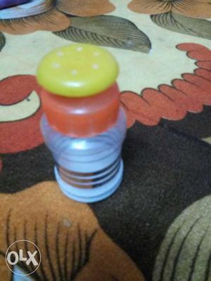 White, Red, And Yellow Condiment Shaker