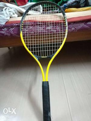Yellow And Black Tennis Racket in good condition dampener