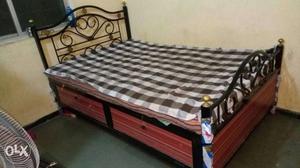 Black And Brown Wooden And Metal Bed