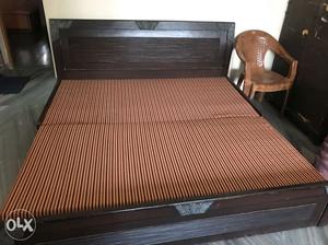 Black Wooden Bed Frame With Brown Mattress
