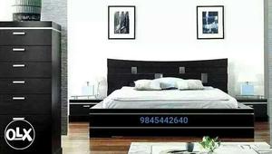 Black Wooden Bed With White Bedspread