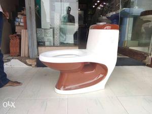 Brown And White Flush Toilet Bowl