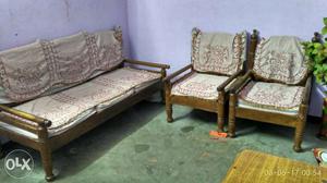 Brown Wooden Bench And Armchairs