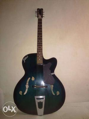 Green And Black Cutaway Acoustic Guitar