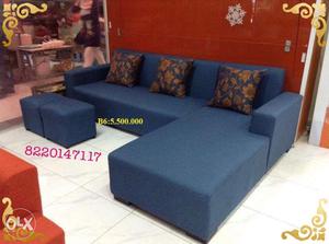 Navy blue colour corner sofa with flower pillows