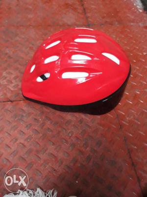 Red And White Bicycle Helmet