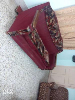 Red sofa in good condition with two extra single sofas