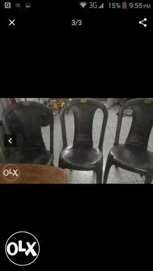 Three Black Plastic Chairs