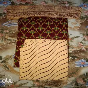 Three Brown, Maroon And White Textiles
