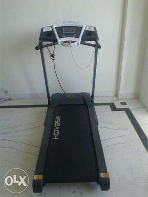 Treadmill with incline adjustments with in-reach toggle