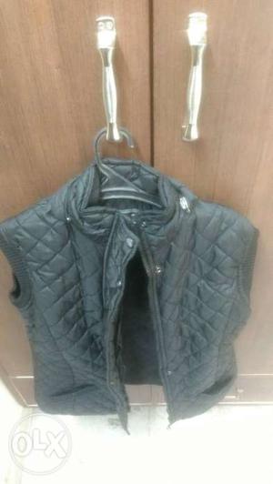 Women black quilted jacket with detachable cap