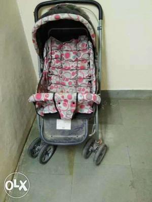 Baby's Gray And Red Stroller