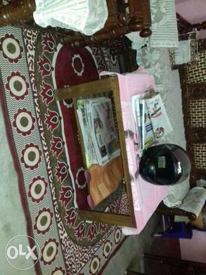 Brown Wooden Center Table With Pink Cover