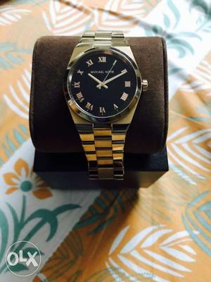 Michael Kors women watch with a black dial.
