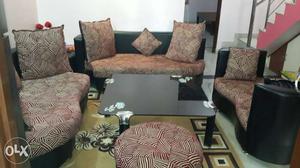 Stylish 9 seater sofa with round table.
