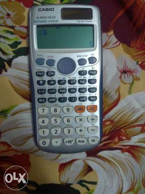 Blue And Gray Casio Graphing Calculator