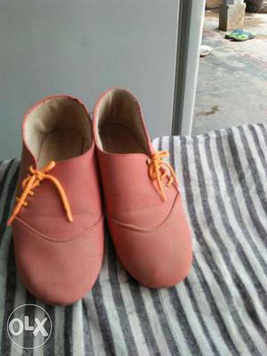 Girl's Pair Of Pink Shoes