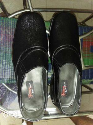 Pair Of Black Suede Slip On Shoes