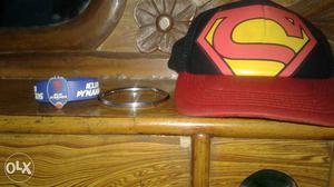 A superman cap, nylon lion band and a cool