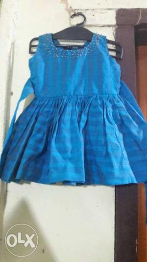 Aqua blue frock with beeds work on neckline for