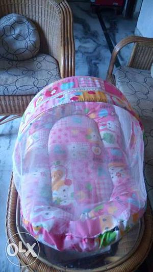 Baby bed with net and pillow