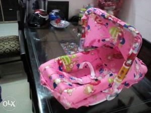 Baby's Pink And Blue Car Seat