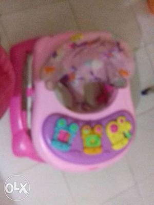 Baby's Pink And Purple Plastic Walker
