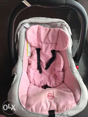 Baby's White And Pink Seat Carrier