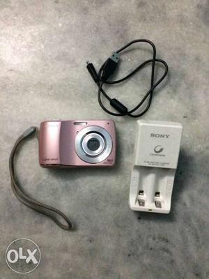 Pink Digital Camera With White 2-bay Battery Charger