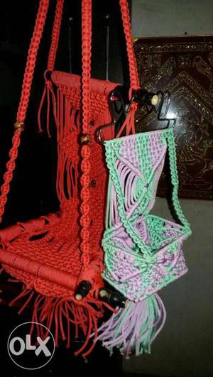 Two Knitted Red And Teal-pink Swings
