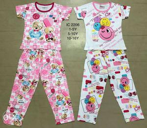 Two Pairs Of Pink And White Pajama Sets