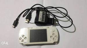 White Game Console With Black Charger