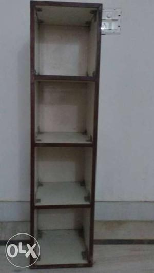 A wooden multipurpose rack in good condition,