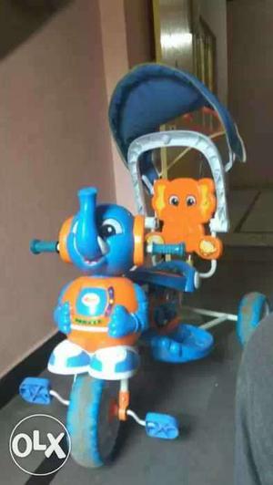 Baby's Blue, Orange, And White Elephant Themed Push Trike