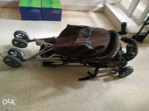 Baby's Brown And Black Pram Stroller