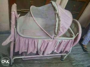 Baby's Pink And White Crib