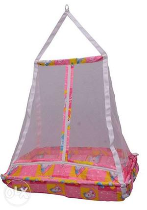 Baby's Pink, White, And Yellow Nest With Mosquito Net