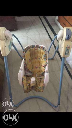 Baby's White And Brown Swing