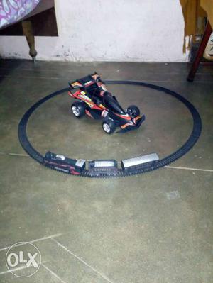 Black And Orange Sport Car toy with train set