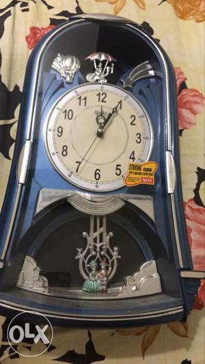Blue And Black Pendulum Clock