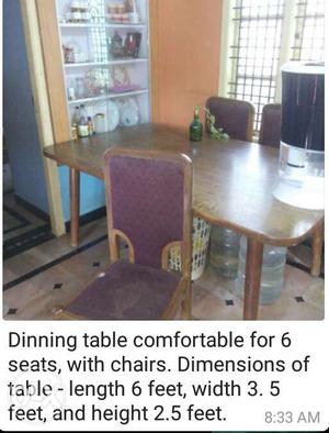 Brown Wooden Dining Table And Chairs Set